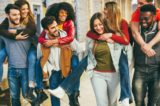 istock Young multiracial people having fun outdoor - Focus on african man face 1439732496