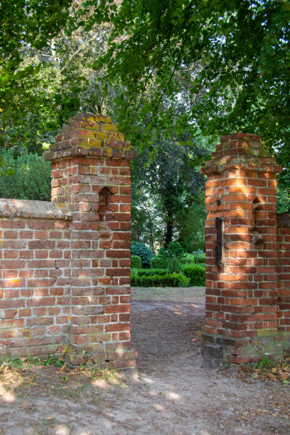 istock Old wall with entrance to the park 1439734455