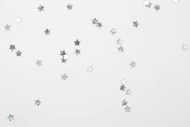 istock sparkles silver stars on white background with text place- Image 1439734534