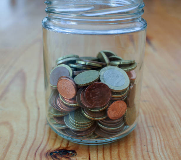 istock glass jar of savings with coins in it 1439734607
