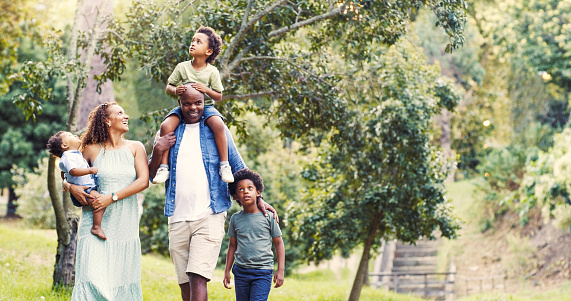 Black family, mother and father with children love nature on summer holidays, vacation or weekend outdoors. Park, black woman and happy African dad enjoys walking and quality time with young kids