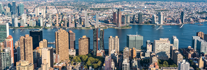 Panoramic aerial view of East river and skyscrapers of Manhattan.