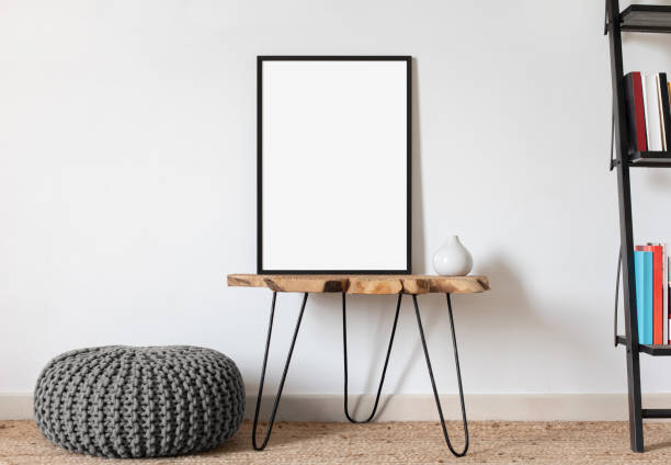 istock Artwork mockup in interior design. Blank picture frame on a wall 1439737549