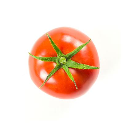 Fresh tomatoes with green leaves isolated on white background