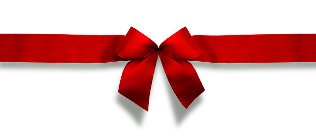 Red christmas ribbon  isolated against white background