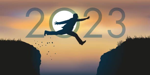 Greeting card showing a man jumping between two rocks to pass in 2023. vector art illustration