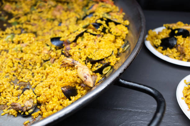 Serving traditional paella Valenciana