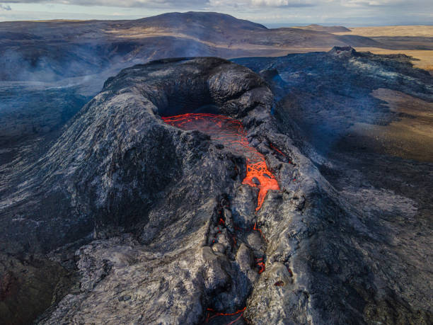 istock Volcanic crater from above with liquid lava 1439744777