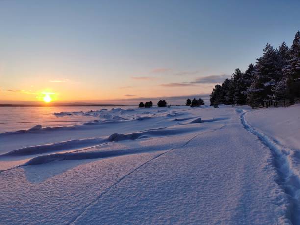 istock Sunset on frozen White sea 1439748480
