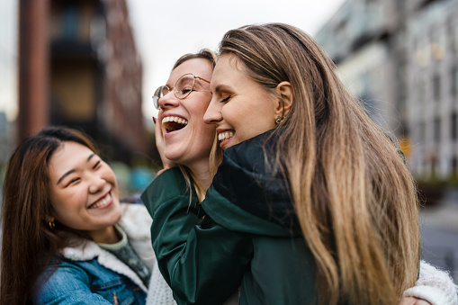 Group of female friends having fun in the city