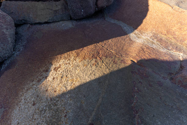 istock The light and shadow produced by the sunshine on the seaside stones 1439748837