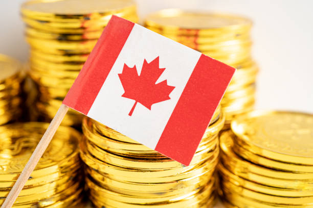 istock Stack of coins money with Canada flag, finance banking concept. 1439750074