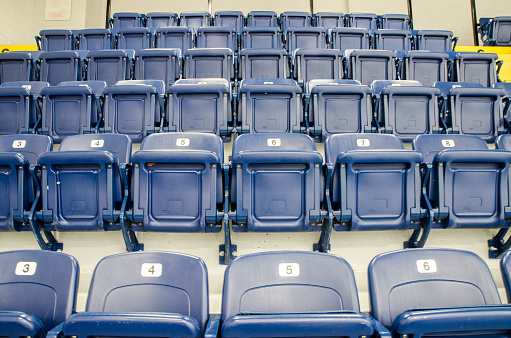 Rows of plastic blue seats in arena