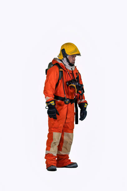 istock Fire man wearing fire protection suite and oxygen tank demonstration dressing on white background 1439752027