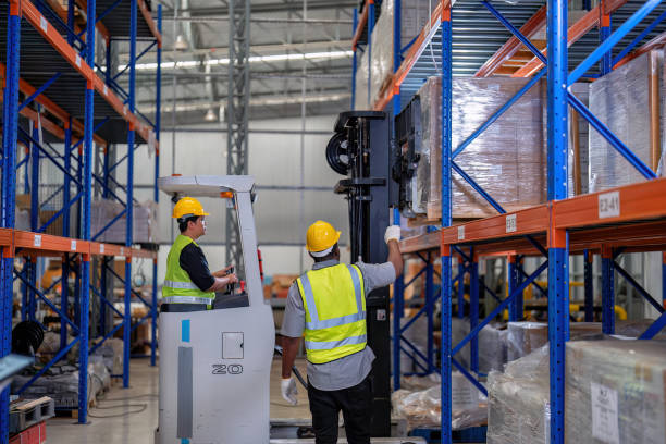 african american working in warehouse hold red light give signal to truck loading carton box - african descent factory accuracy analyzing imagens e fotografias de stock