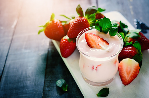 Healthy food of yogurt, Strawberry Yogurt,yogurt with fresh strawberry, wood background