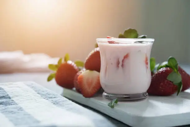 Healthy food of yogurt, Strawberry Yogurt,yogurt with fresh strawberry, dark background