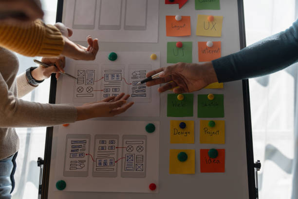 istock Group of ux developer and ui designer brainstorming about app interface design at modern office. Creative digital development agency 1439757029