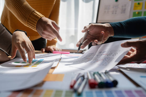 istock Group of ux developer and ui designer brainstorming about app interface design at modern office. Creative digital development agency 1439757180