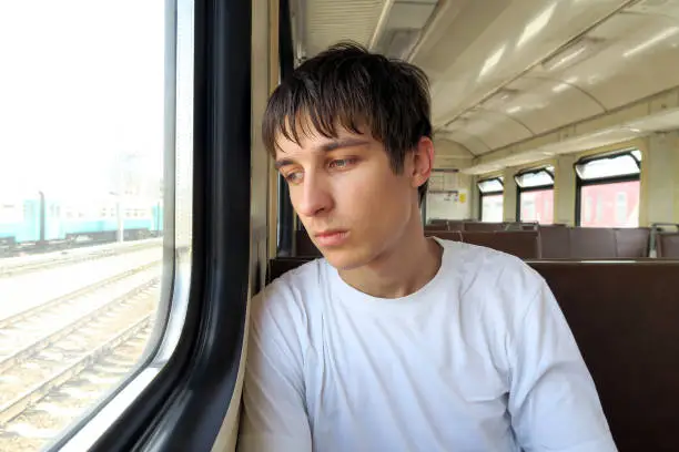 Sad Young Man in the Electric Train