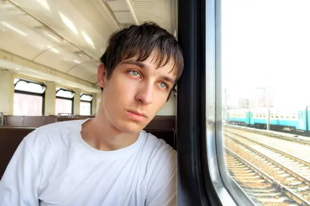 Sad Young Man in the Electric Train