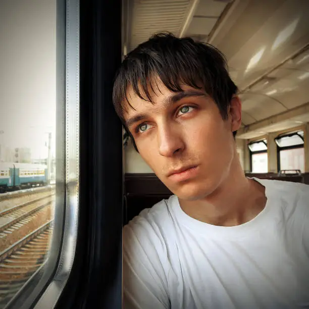 Toned Photo of Sad Teenager in the Train