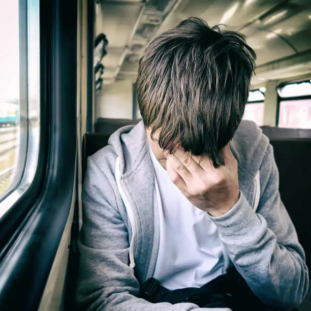 Toned Photo of Sad Young in the Train