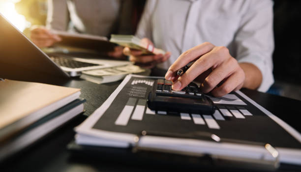 istock wo colleagues discussing data in the background in morning light 1439763587