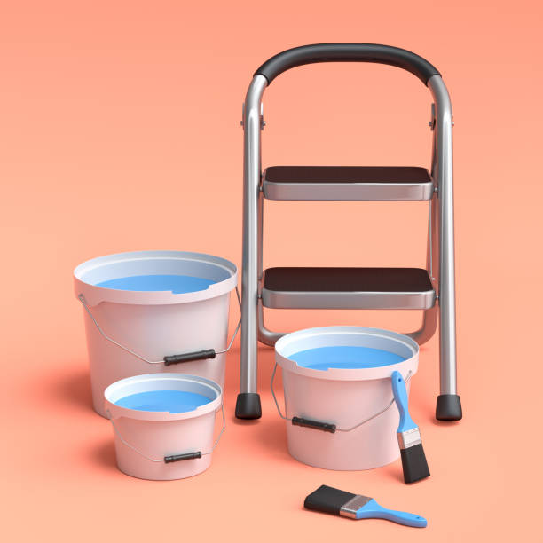 istock Set of folding ladder, bucket with paint rollers and brushes on orange. 1439764774
