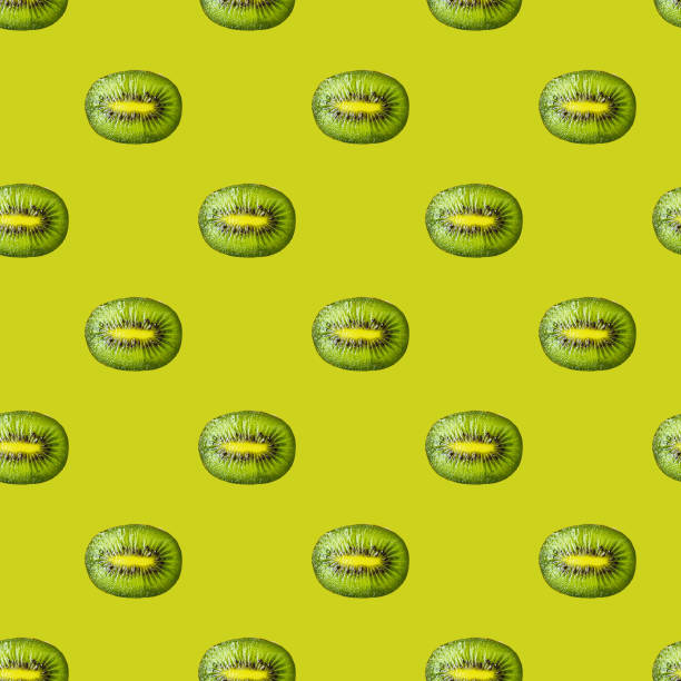 istock Seamless pattern with kiwi slices on a green background. Minimal isometric food texture. Use for boards, print on fabric, 1439766124