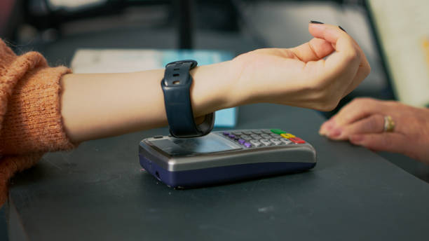 istock Customer buying pharmaceutical products with smartwatch 1439766456