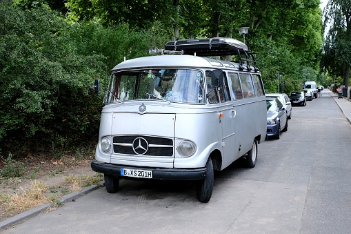 Berlin, Germany – July 06, 2022: Berlin, Germany, July 6, 2022, old Mercedes minibus O 319 in silver mettalic