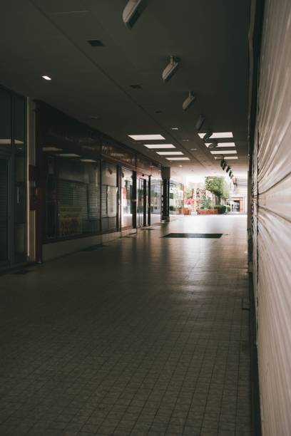 istock Vertical shot of cobblestone empty hall of an underpass with shops 1439770396