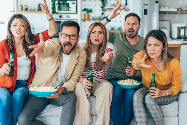 istock Friends watching tv 1439770477