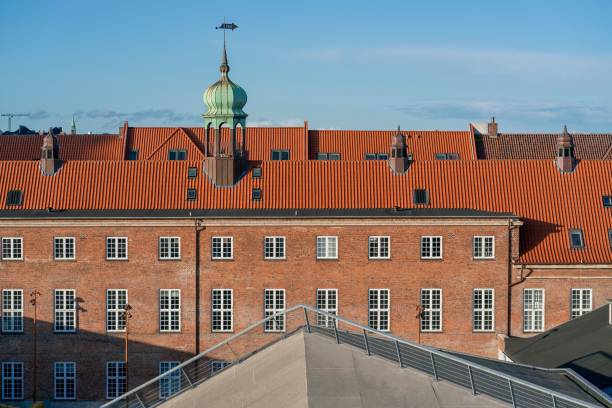 istock Building in Copenhagen with a red rooftop and brick wall on a sunny day 1439771033