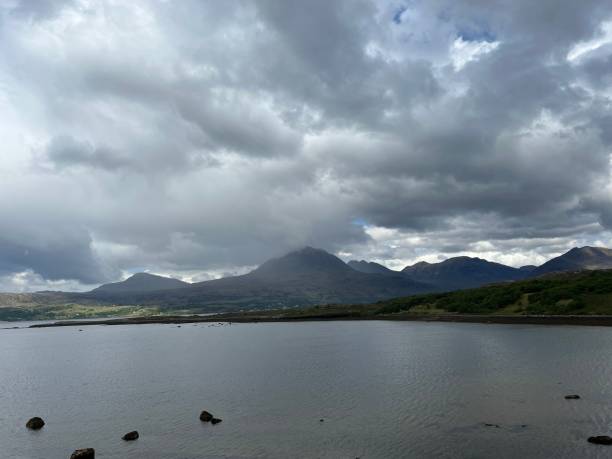 istock Gloomy sky over a mountains and lake landscape 1439771205