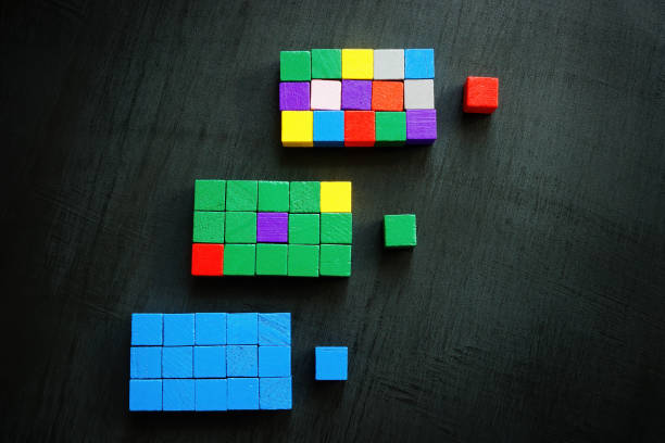 istock Three columns of colored cubes with leaders. Diversity and inclusion at workplace concept. 1439771476