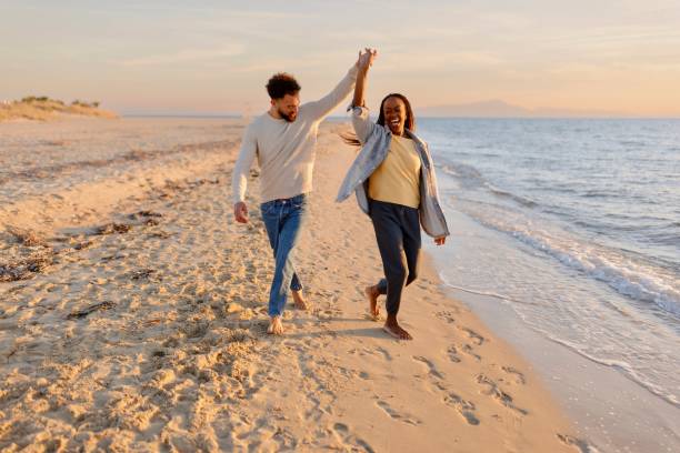 istock Couple dancing at the beach 1439771657