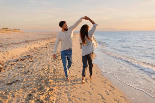 istock Couple dancing at the beach 1439771682