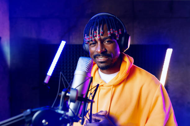 istock Young African performer recording his new track in recording studio 1439771793
