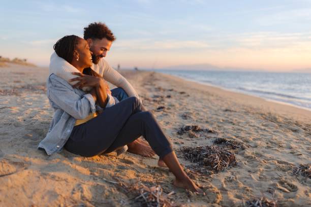 istock Affectionate couple sharing an intimate moment at the beach 1439772119
