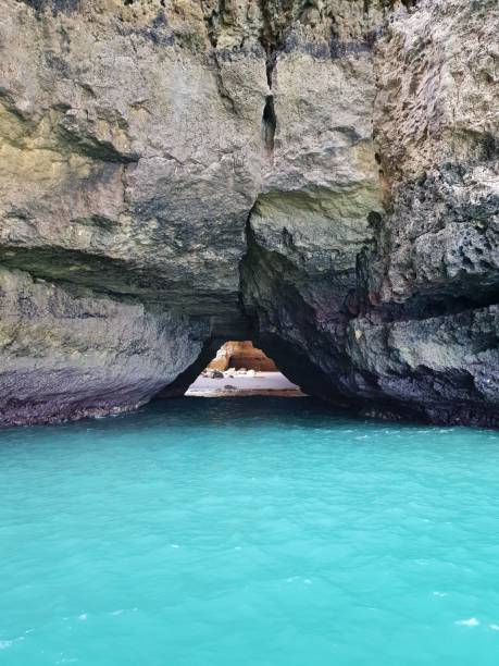 istock Picture of a triangular cave entrance 1439772399