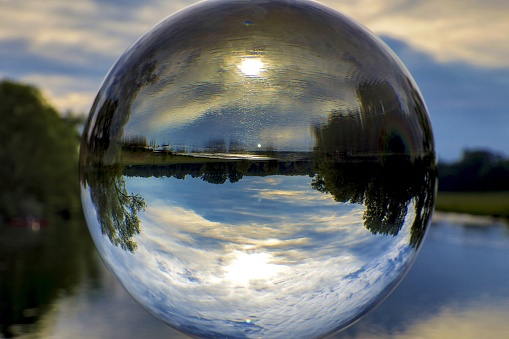 A beautiful shot of nature and lake reflection inside the glass ball