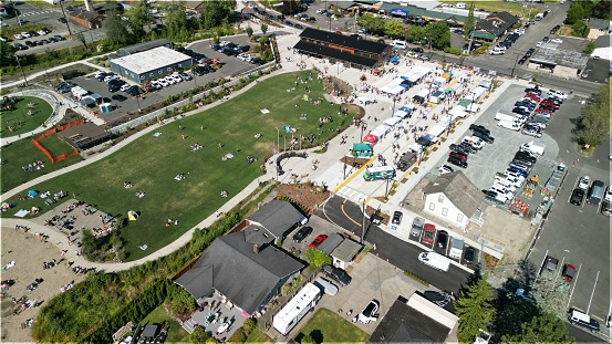 An aerial drone view of Lake Stevens Farmers market and many parked cars