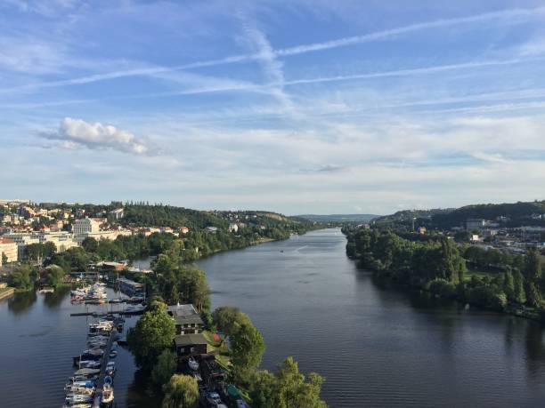 istock Beautiful view of a river in Prague with a blue sky background 1439773329