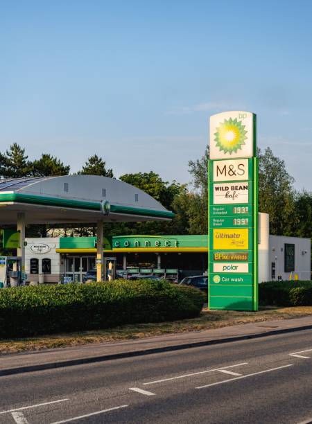 BP petrol station showing high UK fuel price sign portrait Newbury, United Kingdom – July 18, 2022: Newbury, United Kingdom - July 2022: BP petrol station showing high UK fuel price sign portrait asda photos stock pictures, royalty-free photos & images