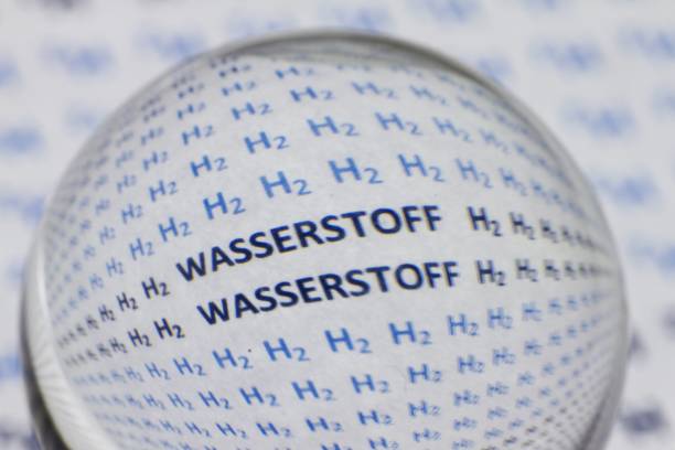 istock Words H2 and hydrogen in German written on a white surface under a magnifying glass 1439775295