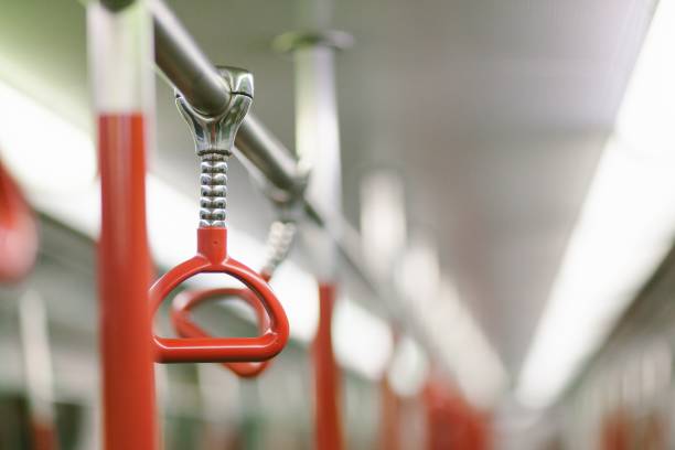 istock Red handrails in the subway train 1439775931