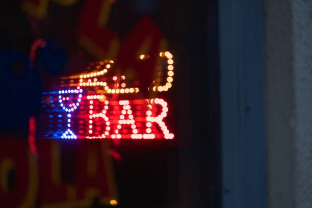 istock Colorful bright lit sign of a bar at night 1439776056
