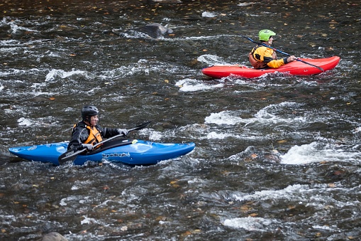 A kayaker getting ready to go down a waterfall in the Liucura river, Pucon, Chile